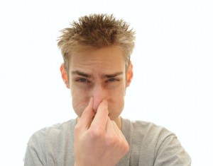 Man Holding Nose Image - New Haven CT Fairfield CT - Total Chimney Care LLC