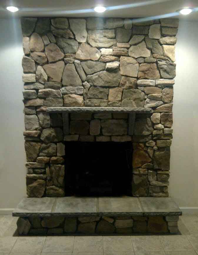 Completed Stone and specialty masonry work on custom stone fireplace, mantle and hearth